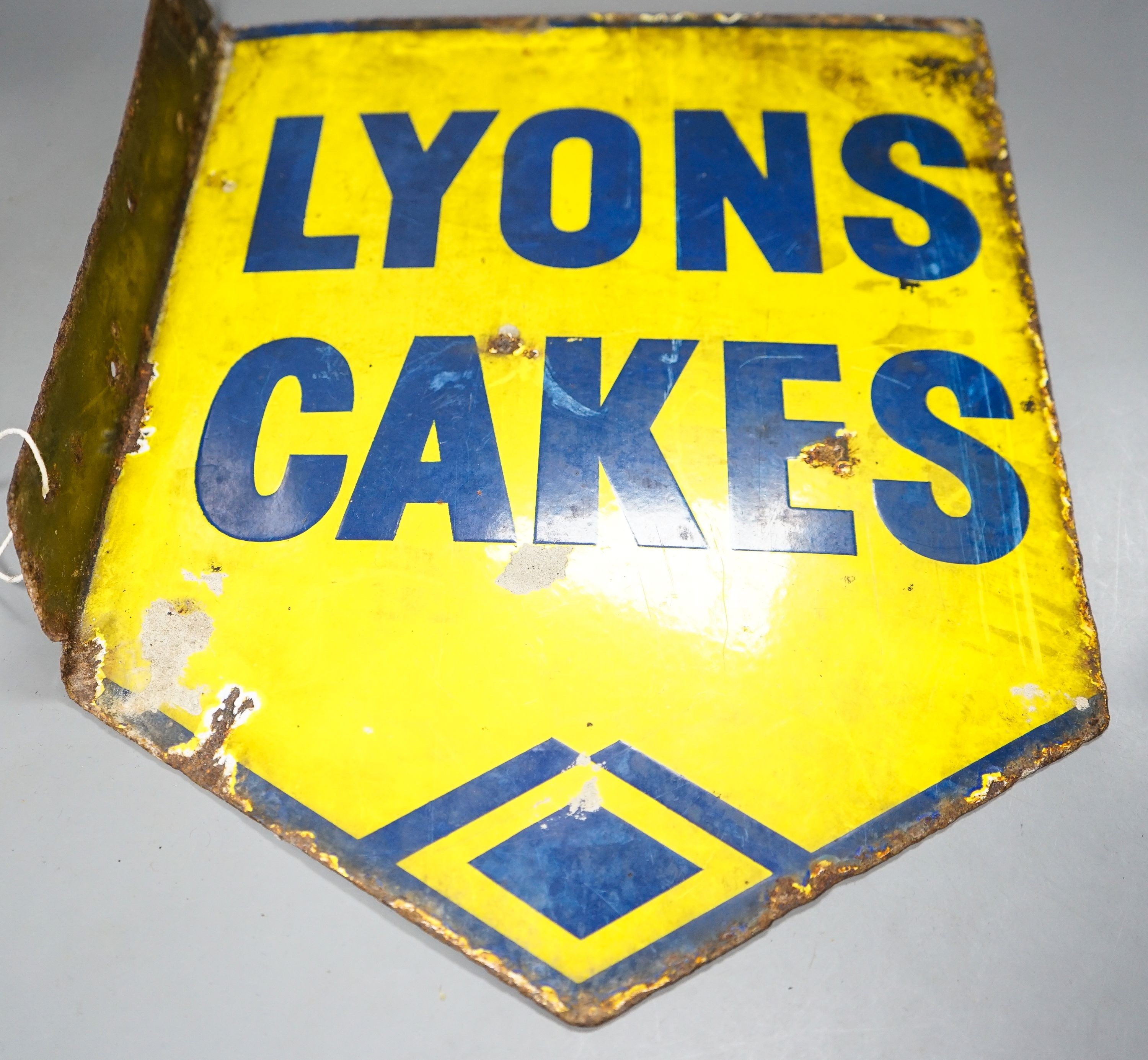 A Lyons Cakes yellow ground enamelled sign 40x32cm